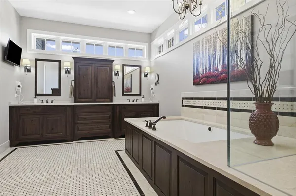 a room with pool table and windows