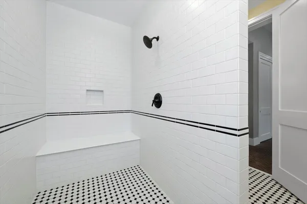 an aerial view of residential houses with yard and car parked