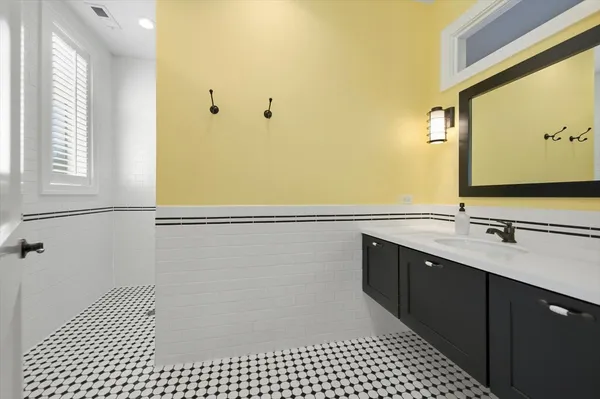 a kitchen with a sink and a refrigerator