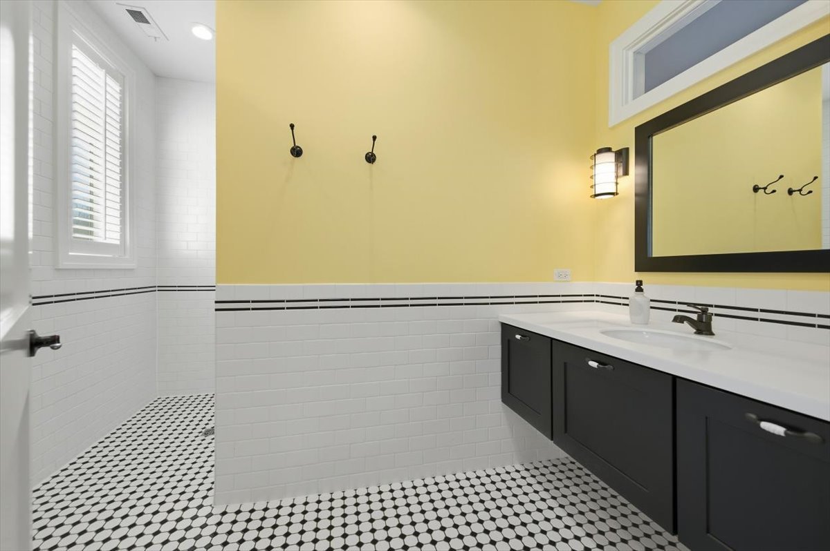 38778 North Ackerman Road Antioch, IL 60002 - Photo 43 of 97 a bathroom with a sink a toilet and vanity