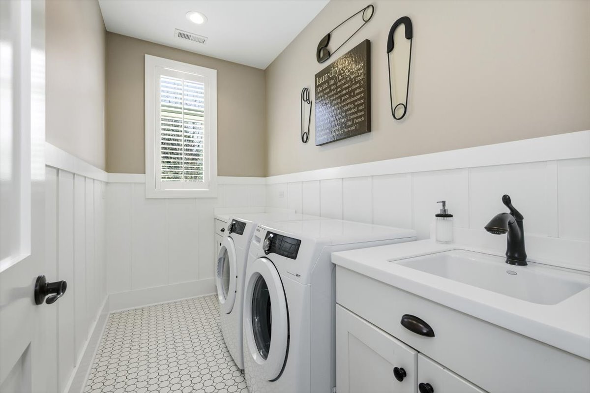 38778 North Ackerman Road Antioch, IL 60002 - Photo 55 of 97 a bathroom with a sink and a washer dryer