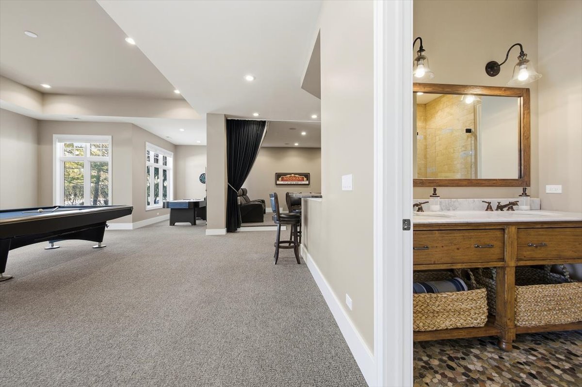 38778 North Ackerman Road Antioch, IL 60002 - Photo 57 of 82 a en suite bathroom with a double vanity sink and a mirror