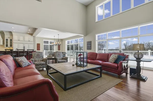 a large kitchen with stainless steel appliances granite countertop a stove a sink dishwasher and a refrigerator