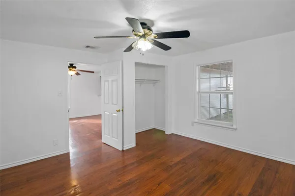 a utility room with stainless steel appliances granite countertop a sink and a cabinets