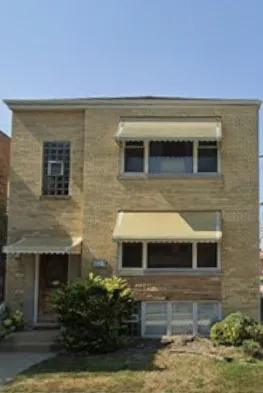 a view of house with yard