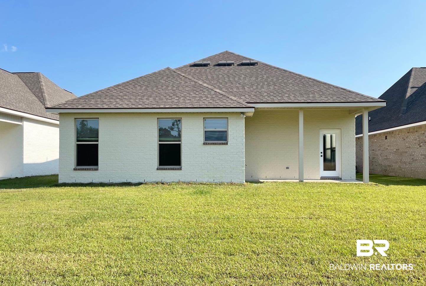 1634 Fenton Circle Foley, AL 36535 - Photo 12 of 14 Rear view of house featuring a yard