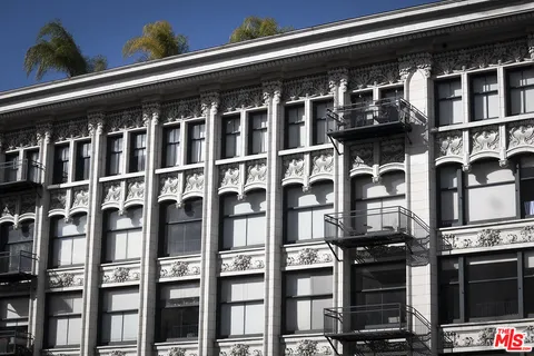 a front view of a building with many windows