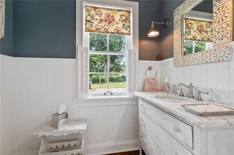 a bathroom with a sink and a window