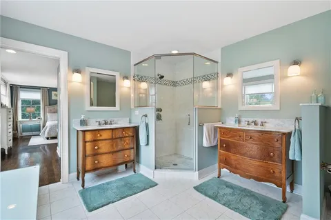a bathroom with a sink a vanity and a mirror
