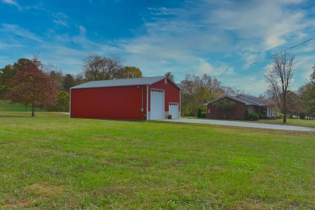a backyard of a house with wooden fence