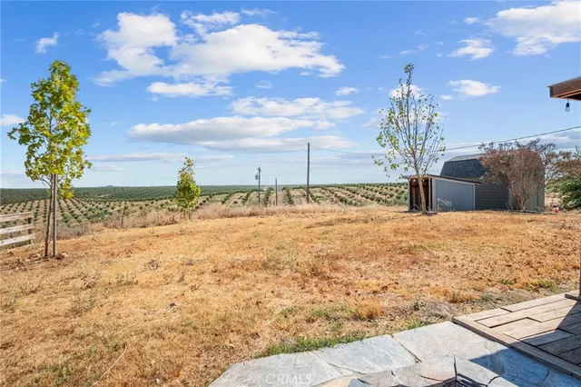 a view of a backyard of the house