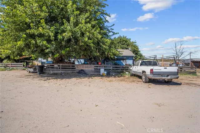 a view of swimming pool and trees in the background