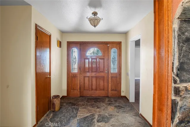 a view of a hallway with wooden door