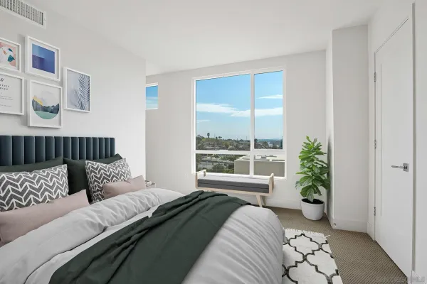 a bedroom with furniture and a window
