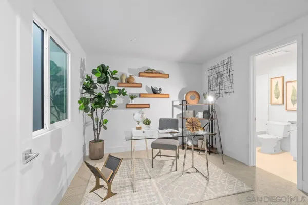 a workspace with furniture and window