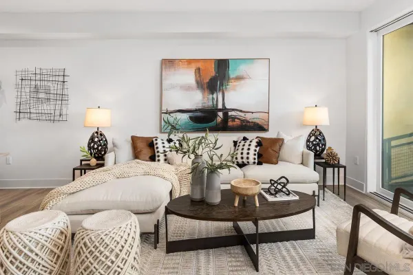 a living room with furniture and a lamp