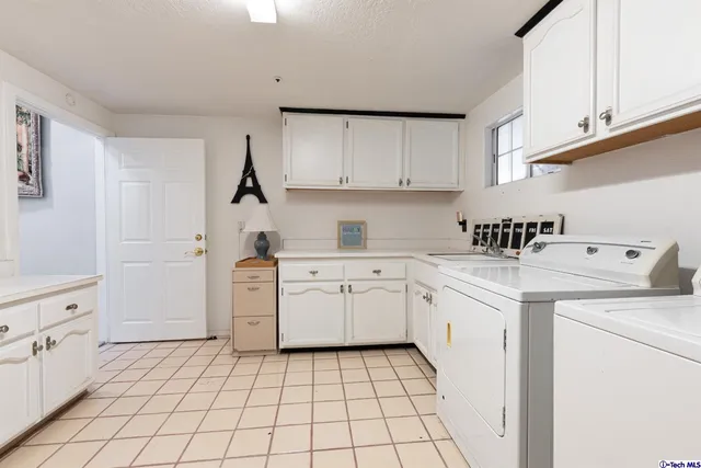 a kitchen with a cabinets and appliances