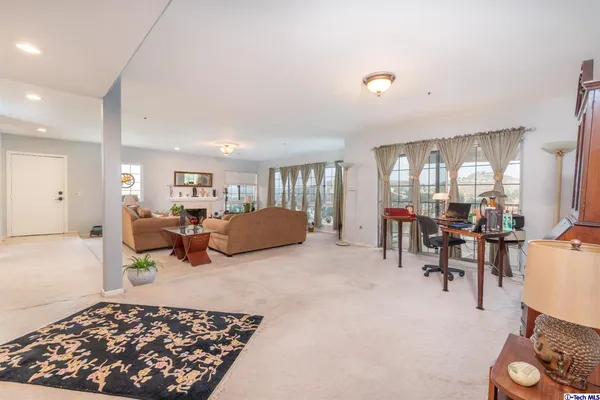 a living room with furniture and a table