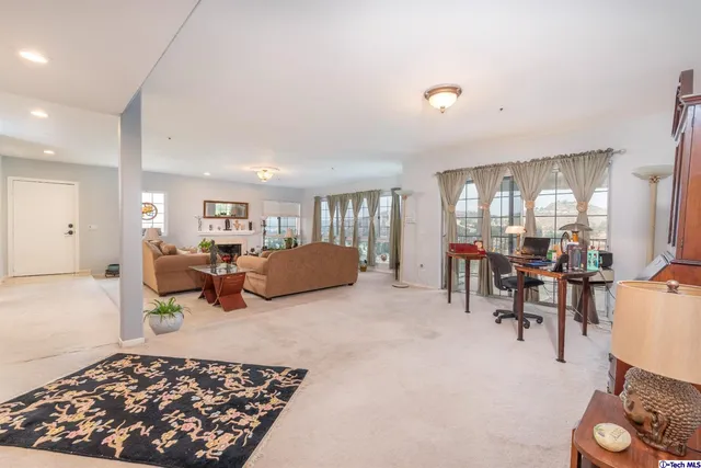 a living room with furniture and a table