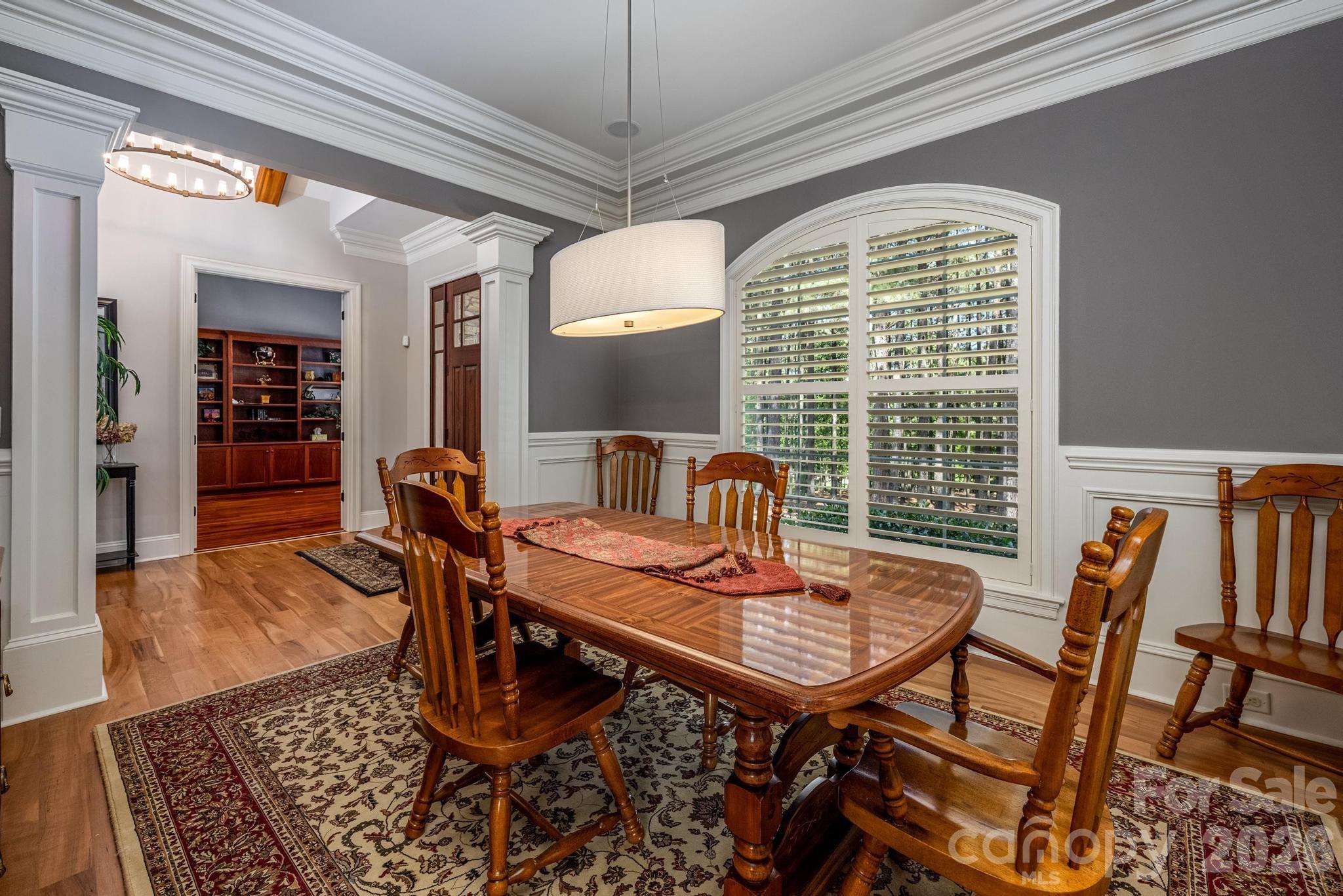 7315 Bay Ridge Drive Denver, NC 28037 - Photo 21 of 39 a view of a dining room with furniture window and wooden floor