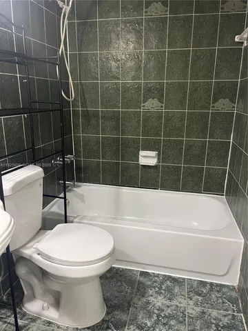 a bathroom with a sink and a shower