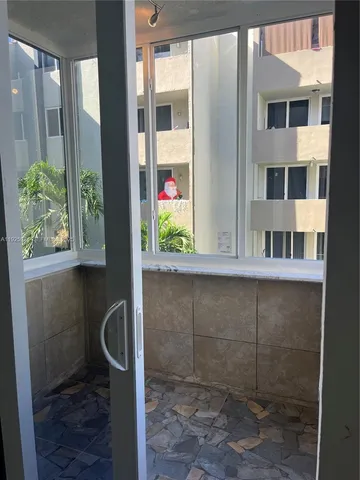 a view of a bathroom with a shower and a sink