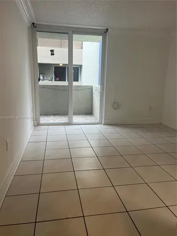 a view of a kitchen empty room and kitchen