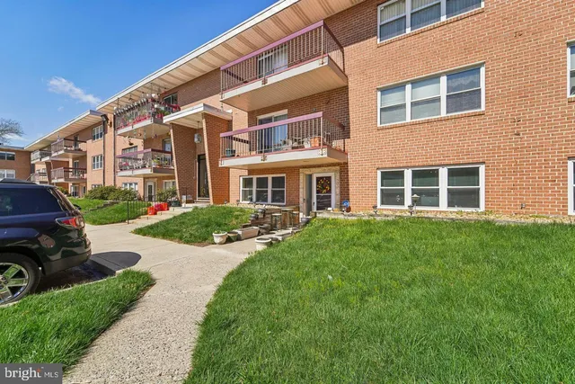 a front view of a house with a yard and porch