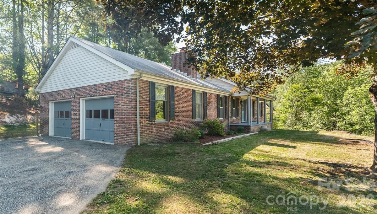 14 Jack Sullins Road Spruce Pine, NC 28777 - Photo 3 of 37 a view of a house with yard and a garden