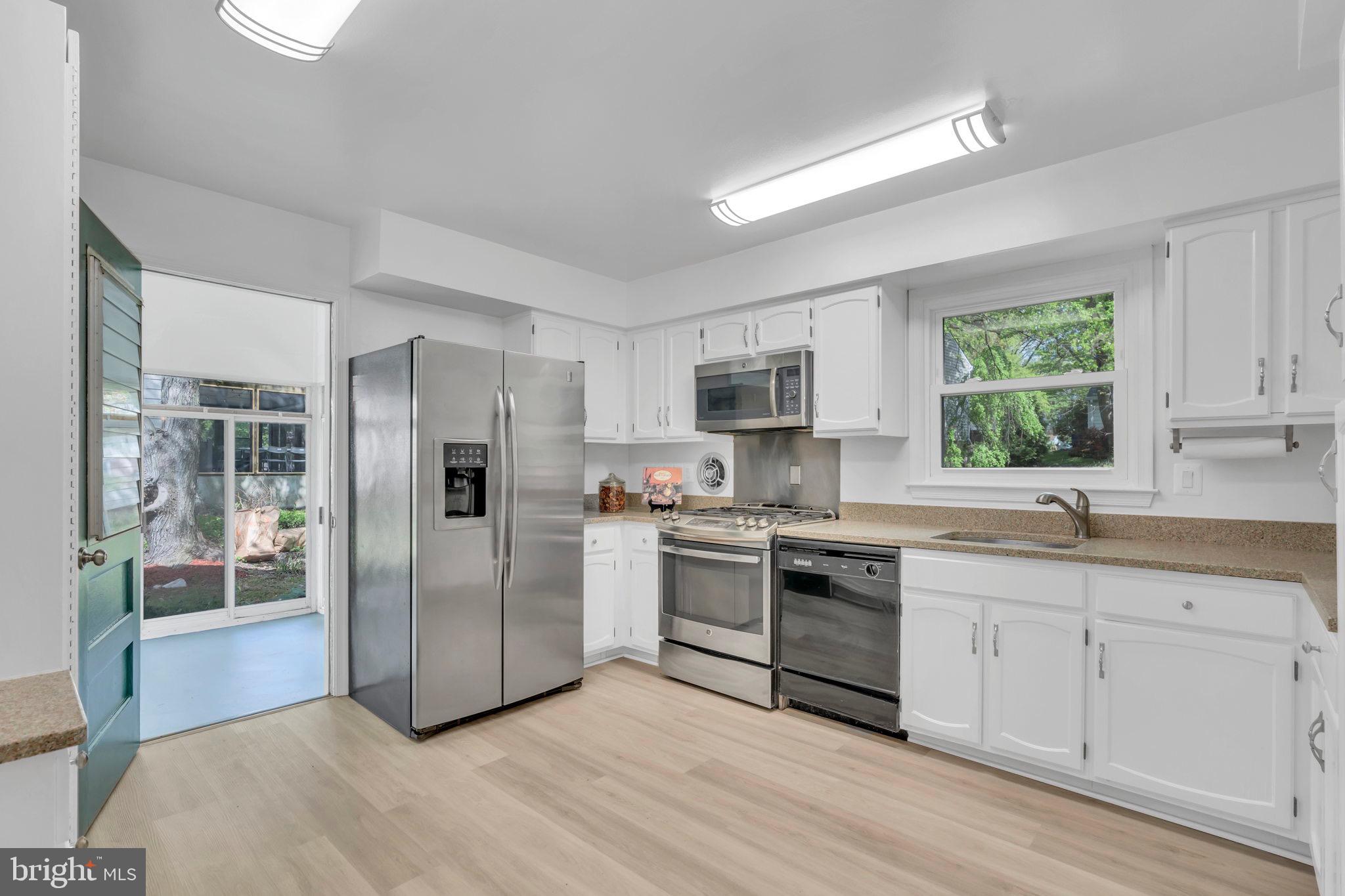 1533 Arbor View Road Silver Spring, MD 20902 - Photo 12 of 37 Large kitchen with access to 3 season room