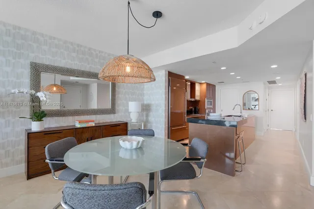 a dining room with furniture a window and kitchen view