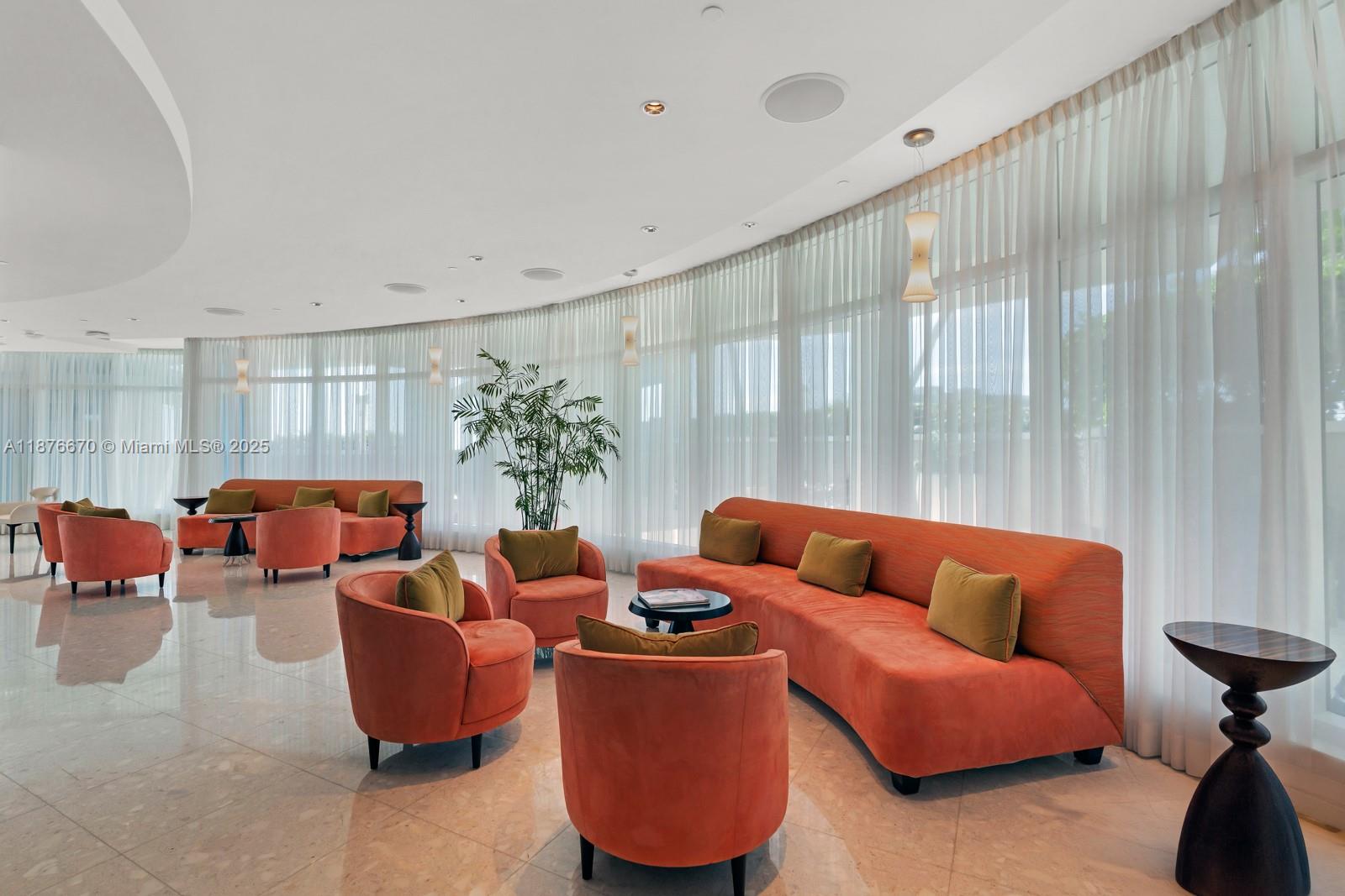 3801 Collins Avenue, Unit 503 Miami Beach, FL 33140 - Photo 21 of 31 a living room with furniture and a large window with garden view