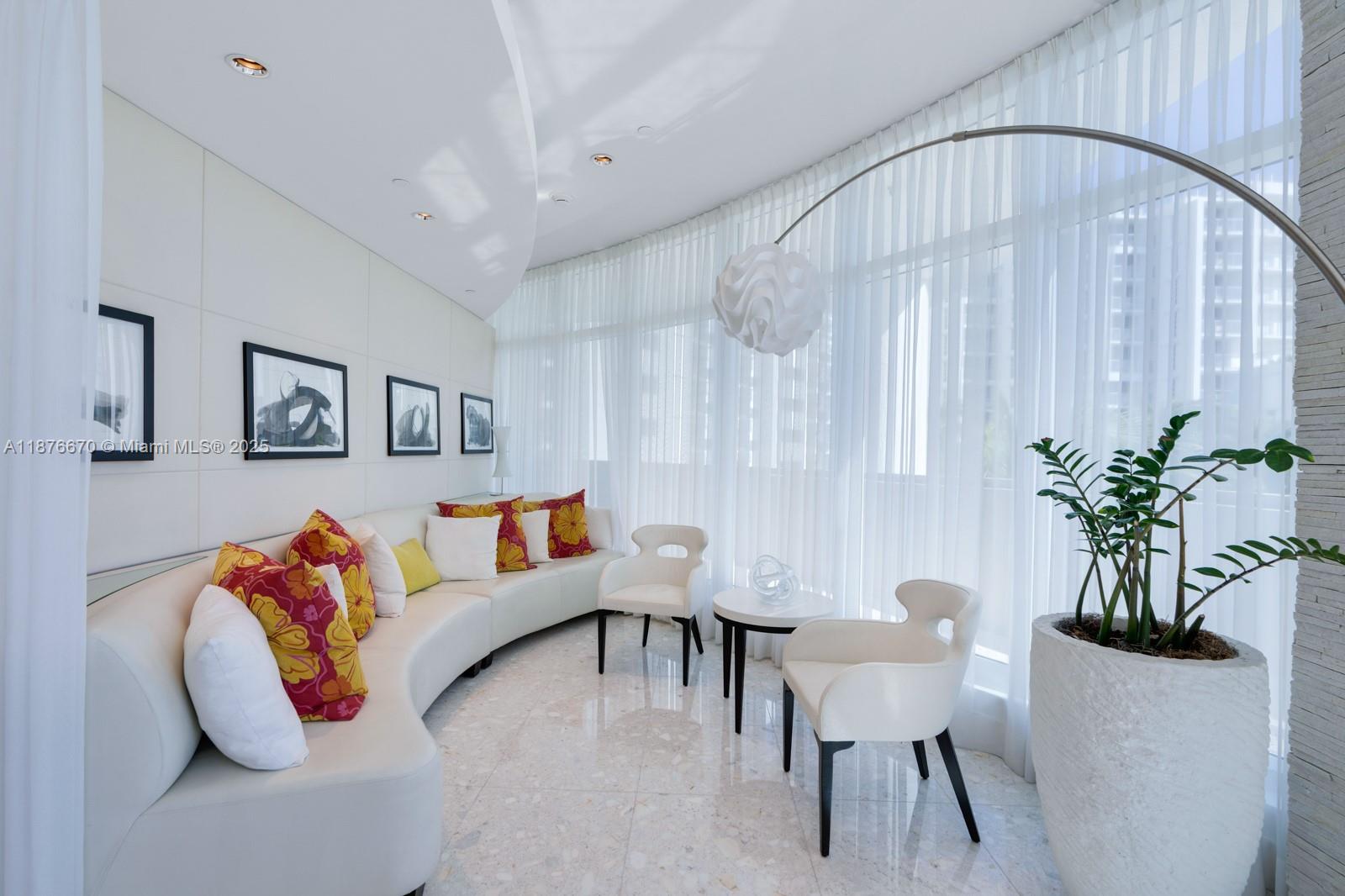 3801 Collins Avenue, Unit 503 Miami Beach, FL 33140 - Photo 23 of 31 a living room with furniture and a potted plant