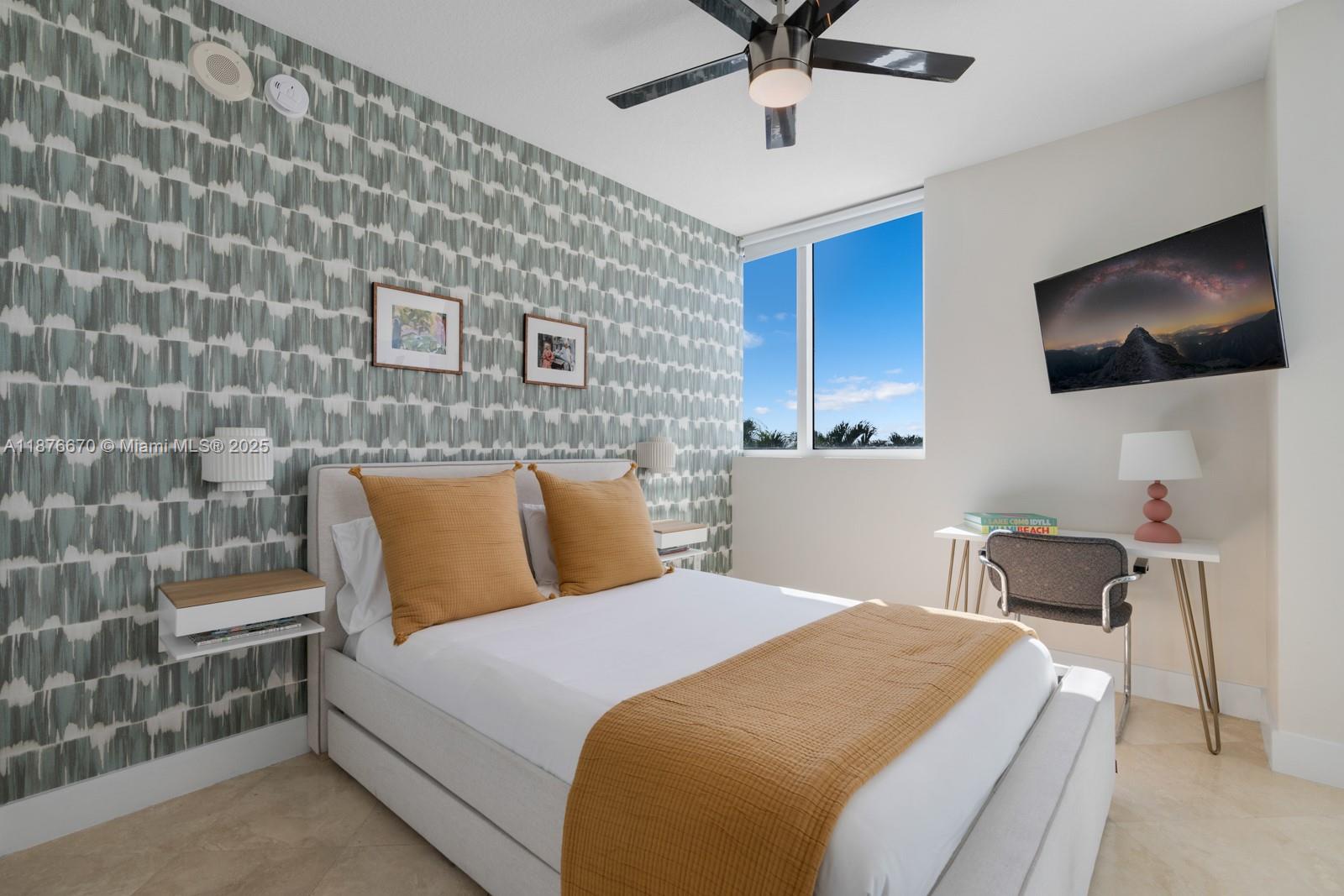 3801 Collins Avenue, Unit 503 Miami Beach, FL 33140 - Photo 7 of 31 a bed room with a bed and a television