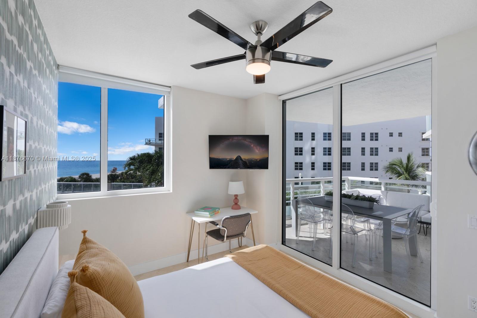 3801 Collins Avenue, Unit 503 Miami Beach, FL 33140 - Photo 8 of 31 a living room with furniture and a flat screen tv