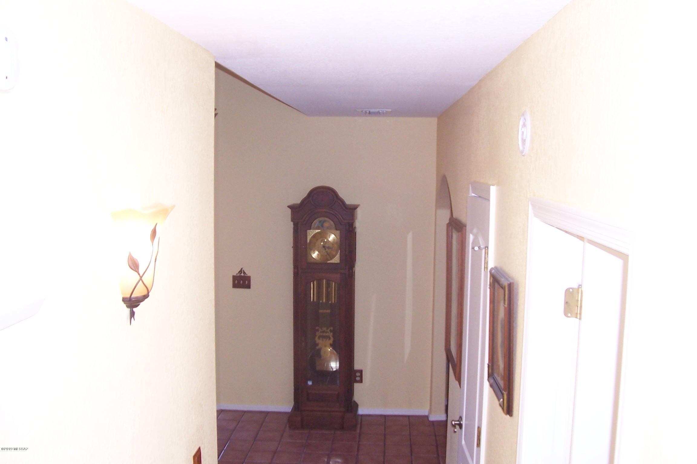 1256 Avenida Gloriosa Rio Rico, AZ 85648 - Photo 22 of 25 a view of a hallway with wooden floor