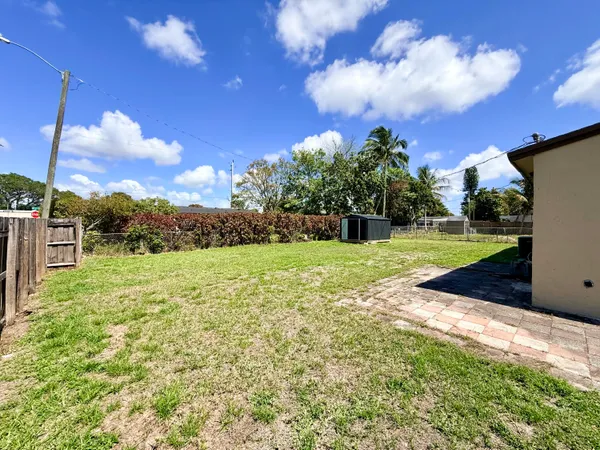 a view of a garden with a house