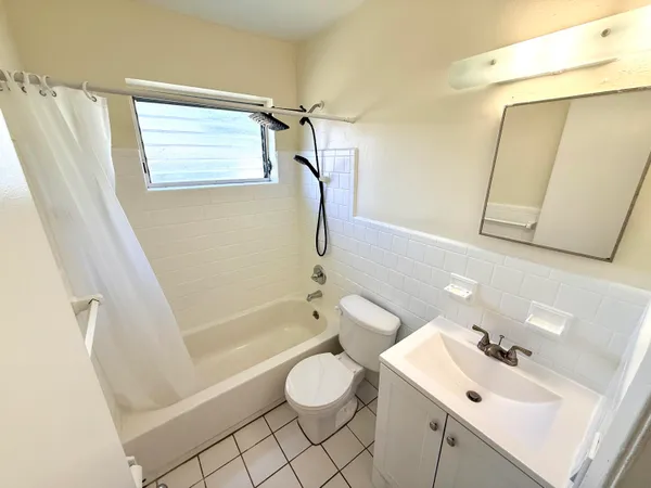 a bathroom with a sink a toilet and a bathtub
