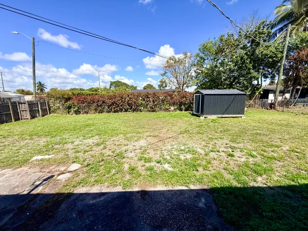a view of a field with an ocean view