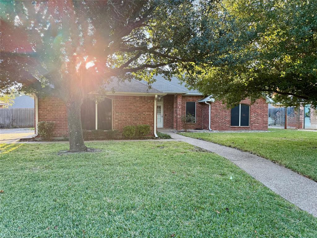 a house with huge green field in front of it