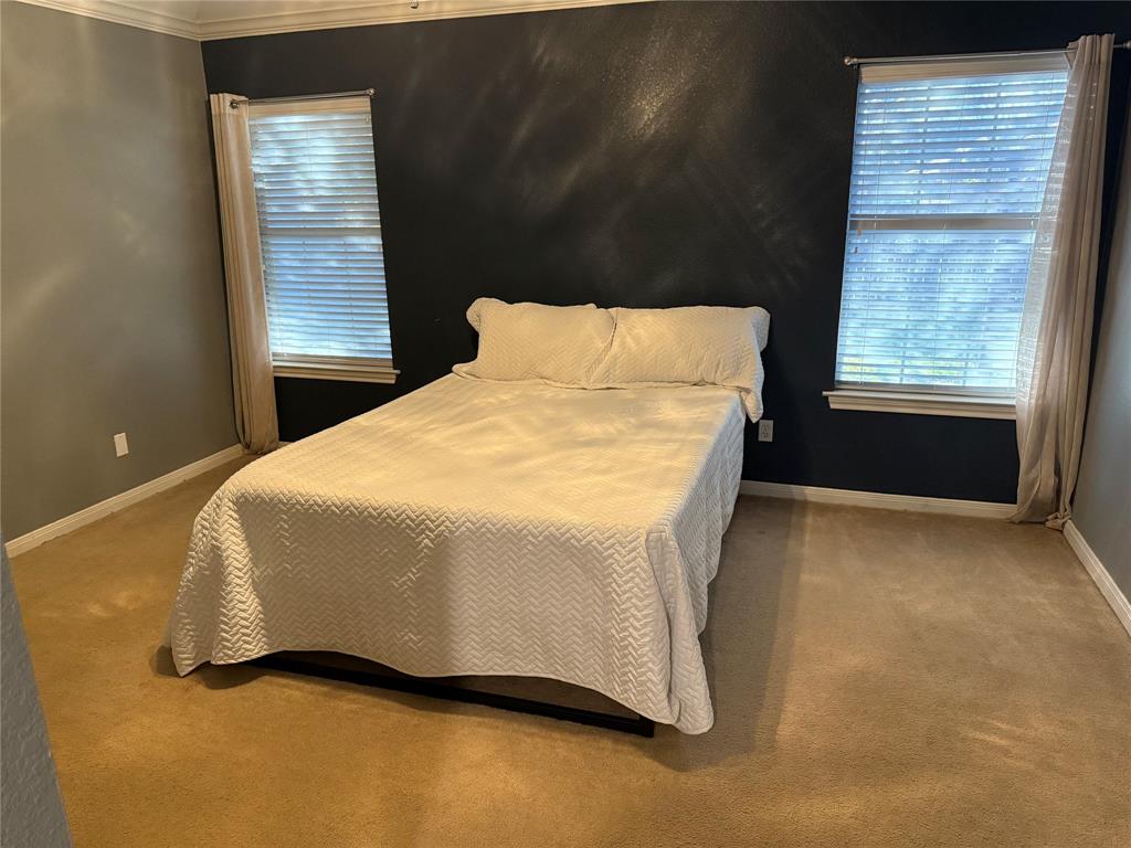 921 Cloud Croft Drive Hewitt, TX 76643 - Photo 12 of 18 a bed sitting in a bedroom next to a window