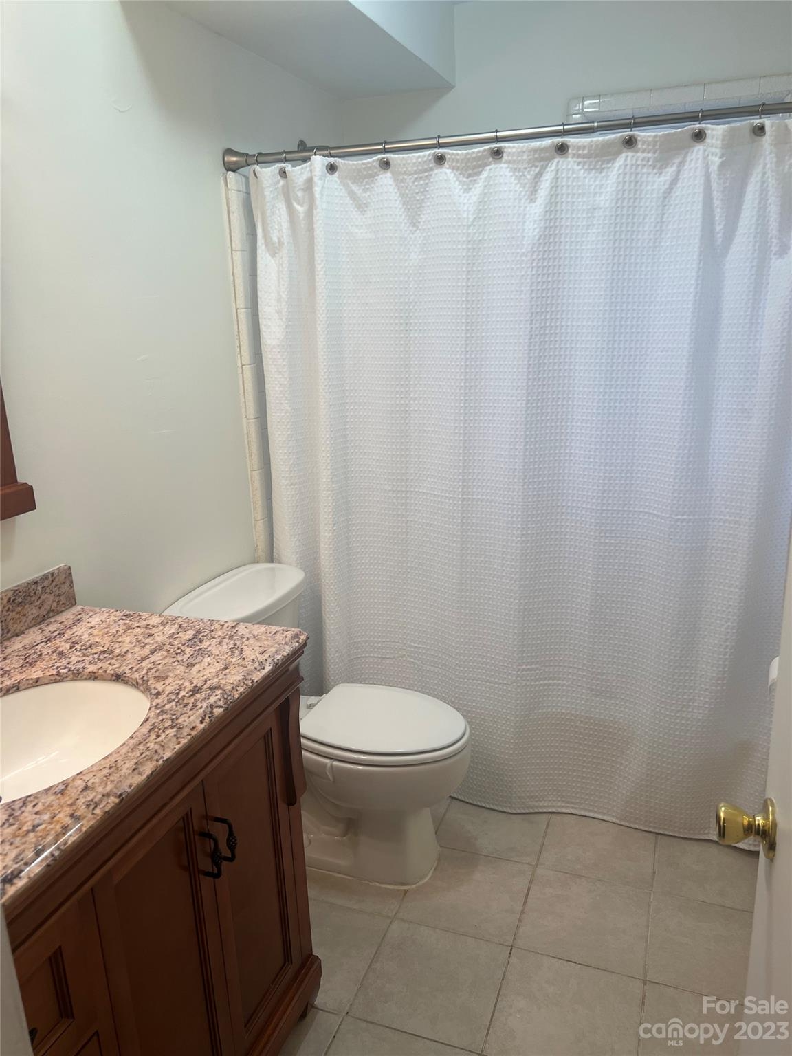 908 McAlway Road Charlotte, NC 28211 - Photo 11 of 13 a bathroom with a granite countertop sink and a toilet