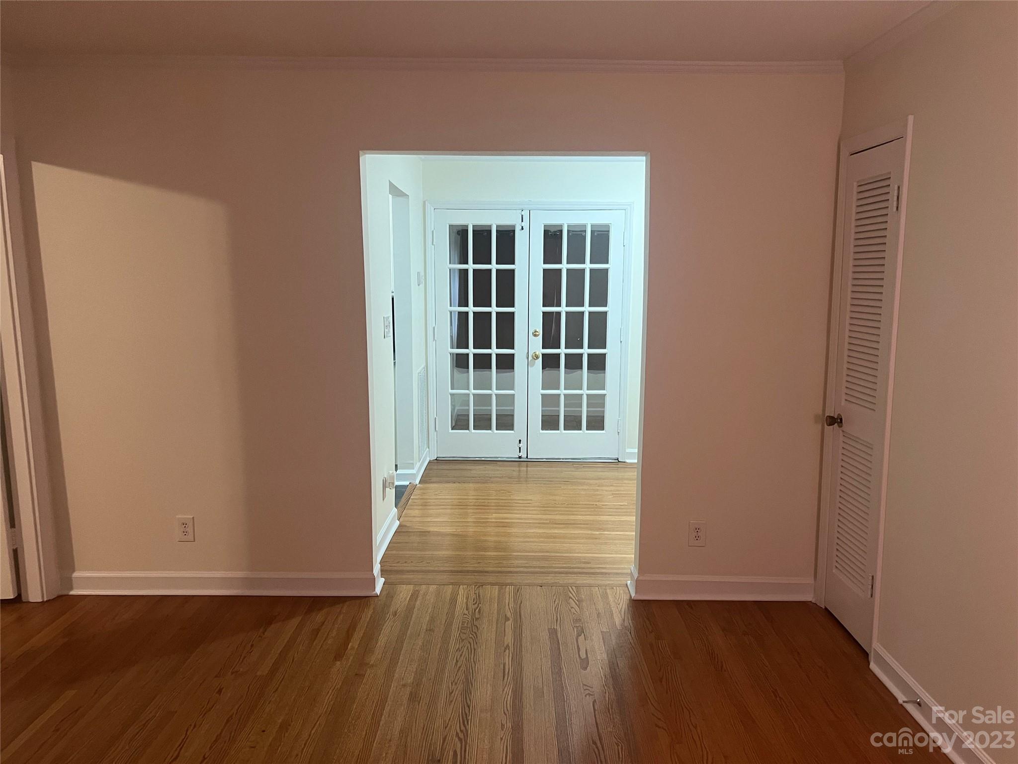 908 McAlway Road Charlotte, NC 28211 - Photo 3 of 13 an empty room with wooden floor and windows