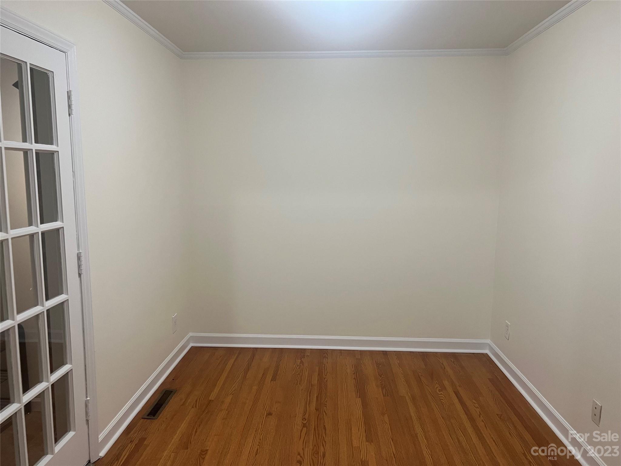 908 McAlway Road Charlotte, NC 28211 - Photo 4 of 13 a view of a small space with wooden floor and a window
