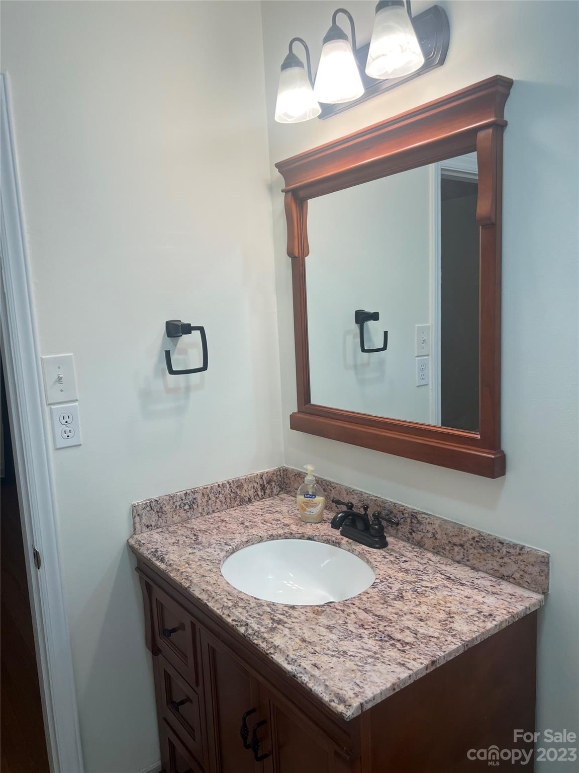908 McAlway Road Charlotte, NC 28211 - Photo 10 of 13 a bathroom with a granite countertop sink and a mirror