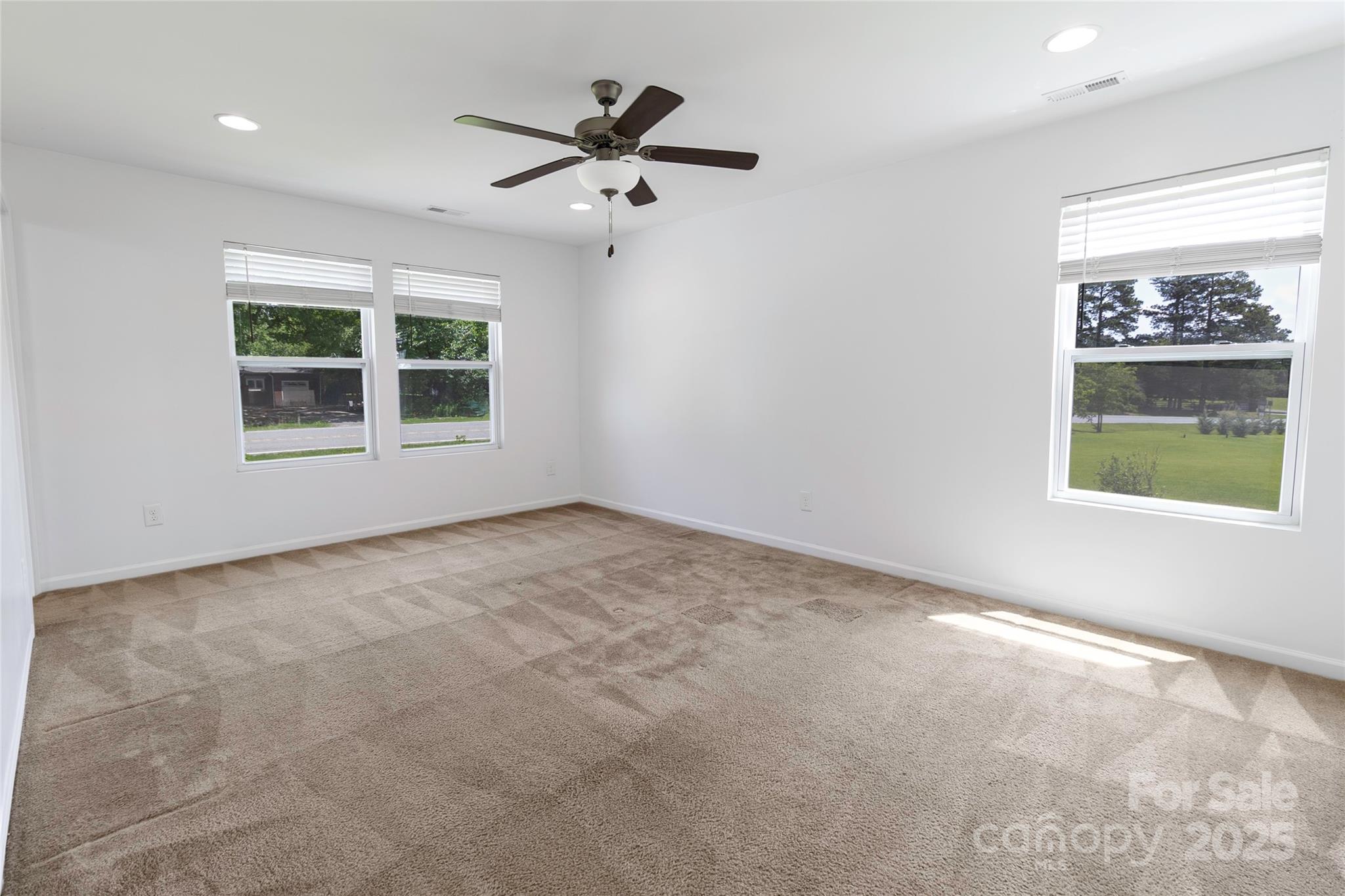 556 Big Lick Road Stanfield, NC 28163 - Photo 14 of 19 an empty room with windows