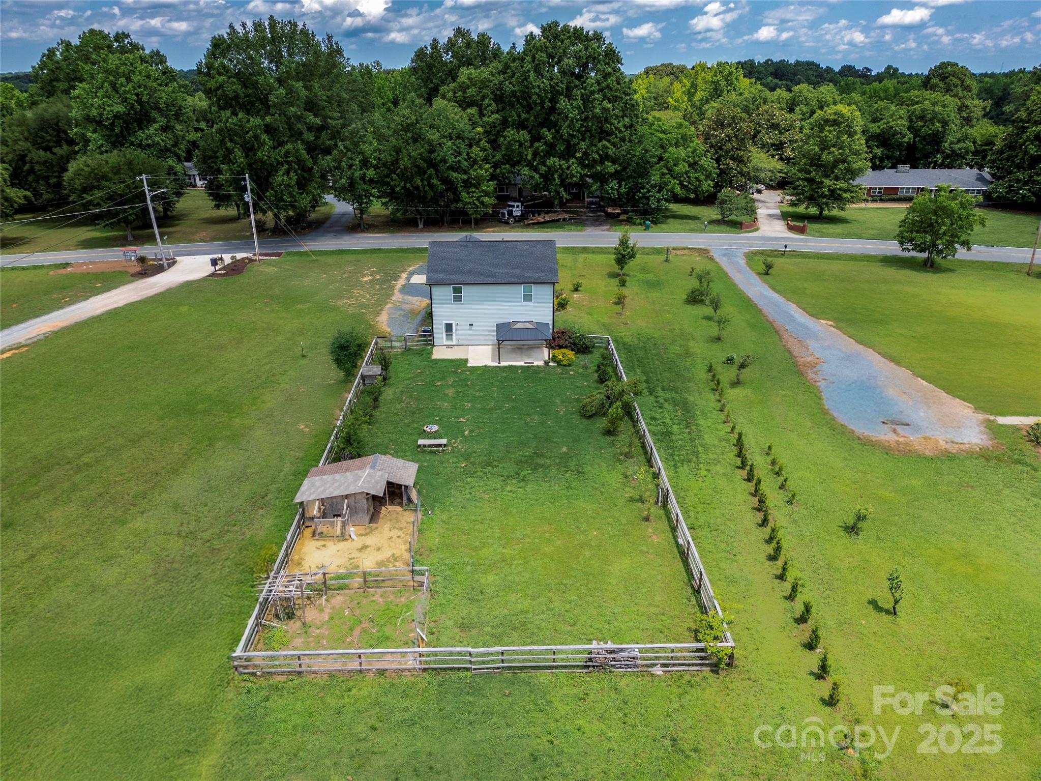 556 Big Lick Road Stanfield, NC 28163 - Photo 17 of 19 an aerial view of a golf course with a swimming pool
