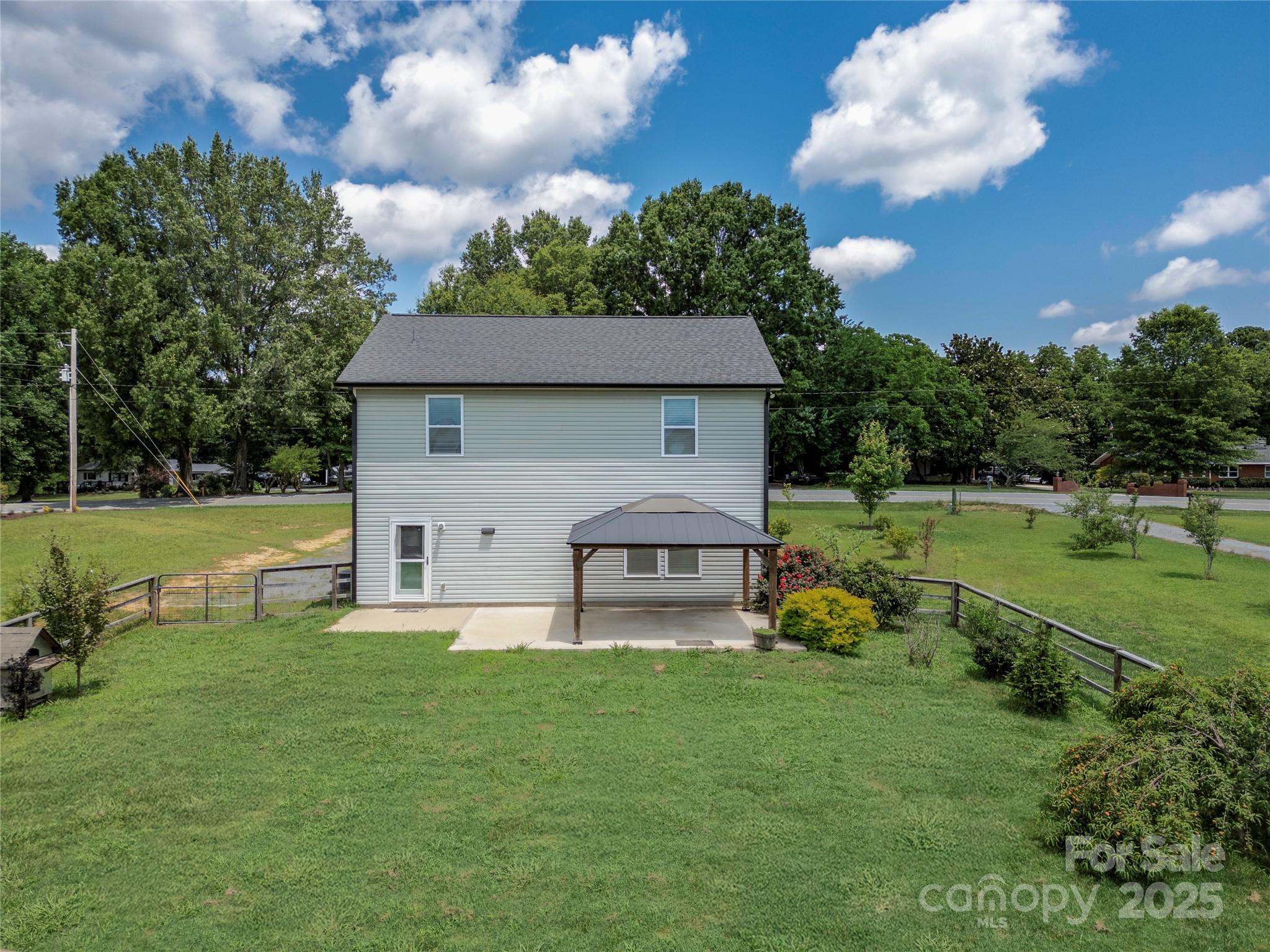 556 Big Lick Road Stanfield, NC 28163 - Photo 18 of 19 a front view of a house with garden