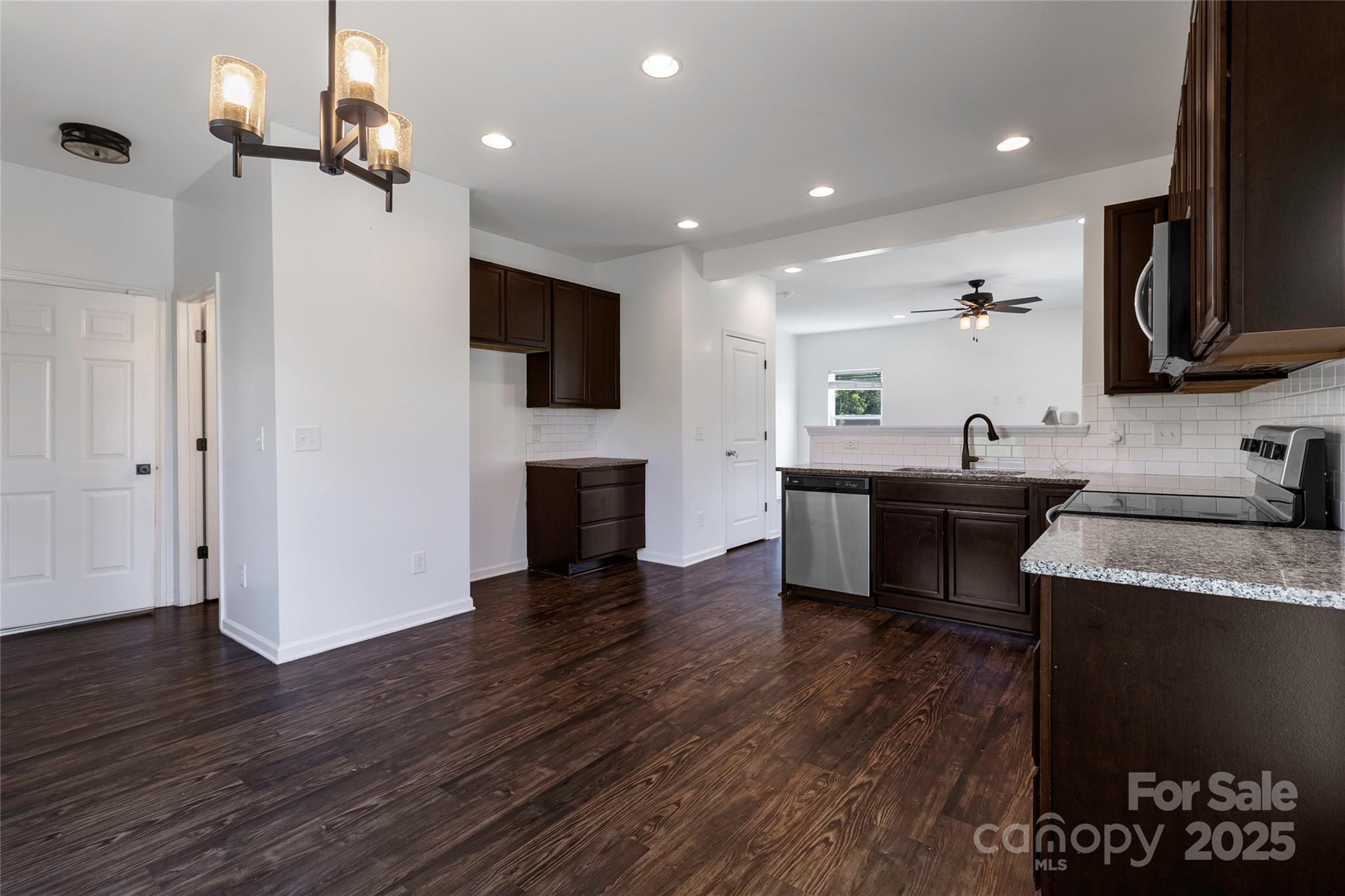 556 Big Lick Road Stanfield, NC 28163 - Photo 7 of 19 a view of kitchen with sink microwave and refrigerator