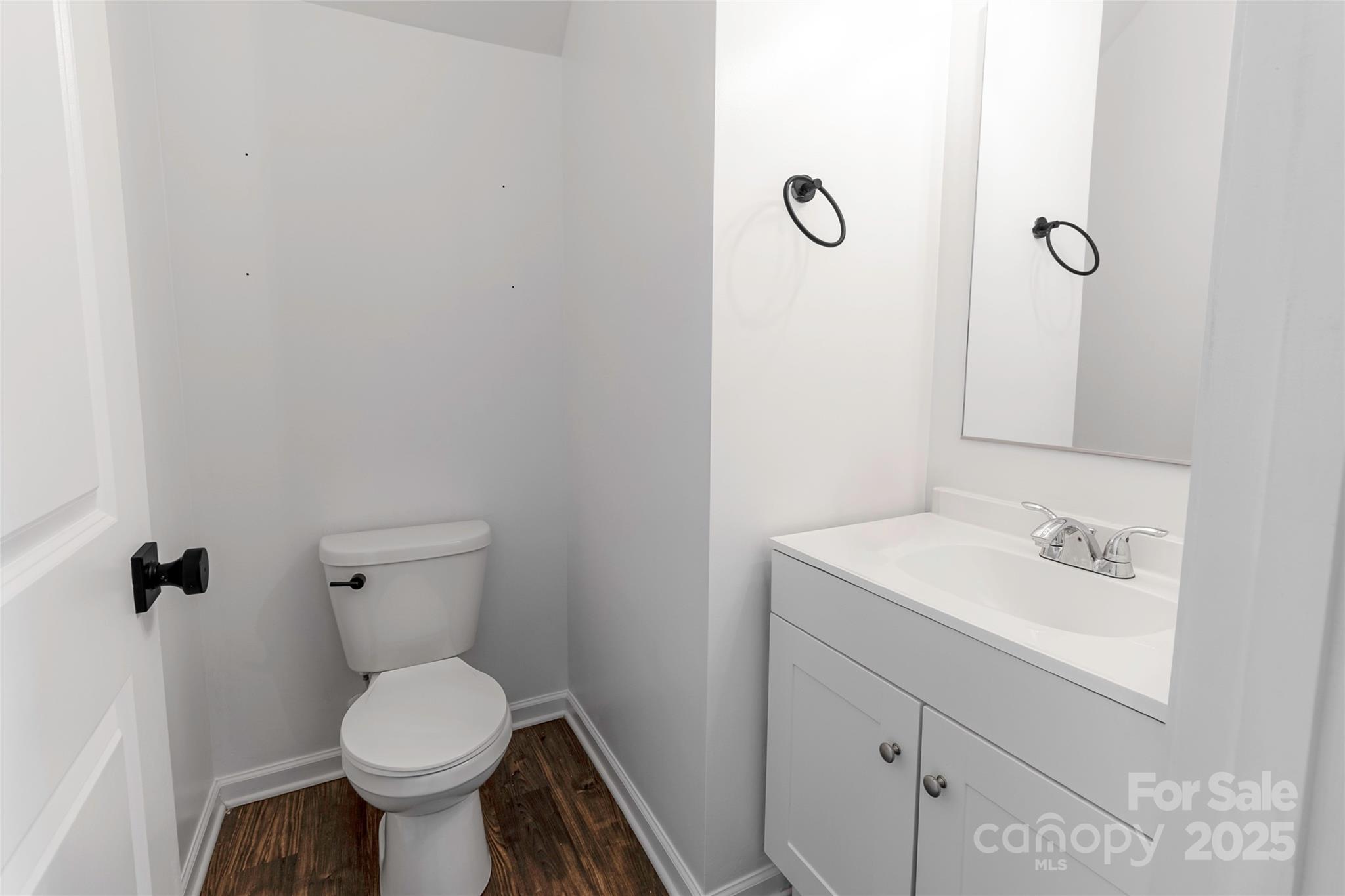 556 Big Lick Road Stanfield, NC 28163 - Photo 8 of 19 a bathroom with a sink toilet and a mirror